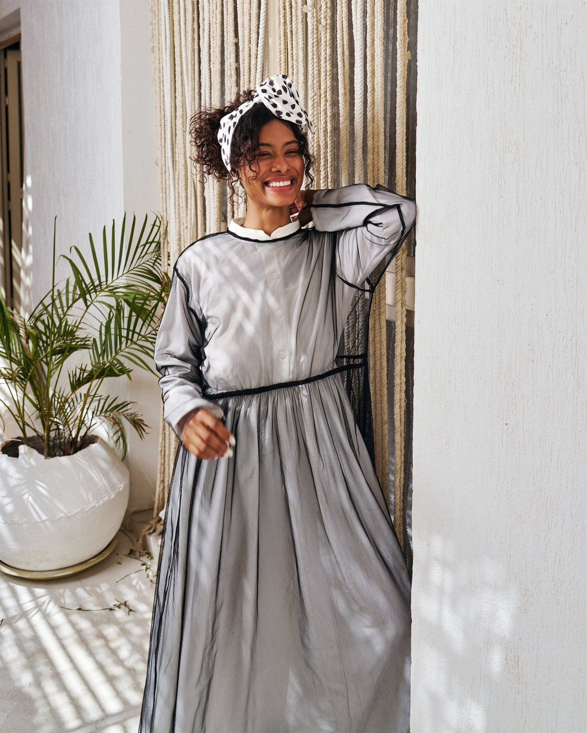 Illusion long sleeve dress in black with chiffon overlay
